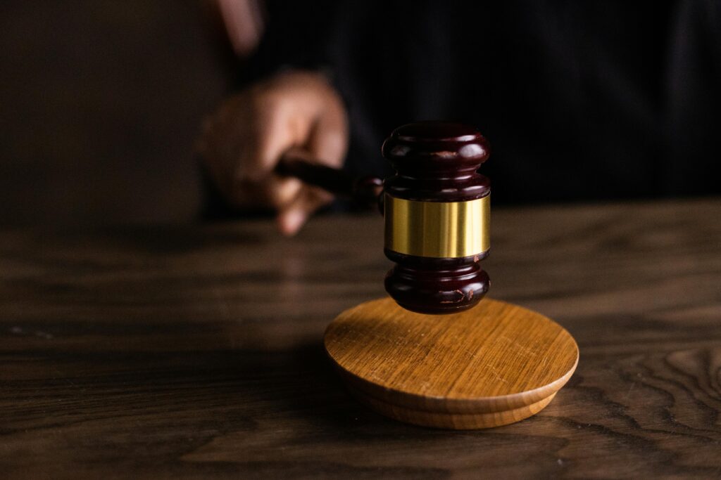 Why I Go the Distance for Justice: My Journey from Hope, Arkansas to the Heart of the Community Impact Initiative A gavel striking a sound block, symbolizing justice and legal authority in a courtroom setting.
