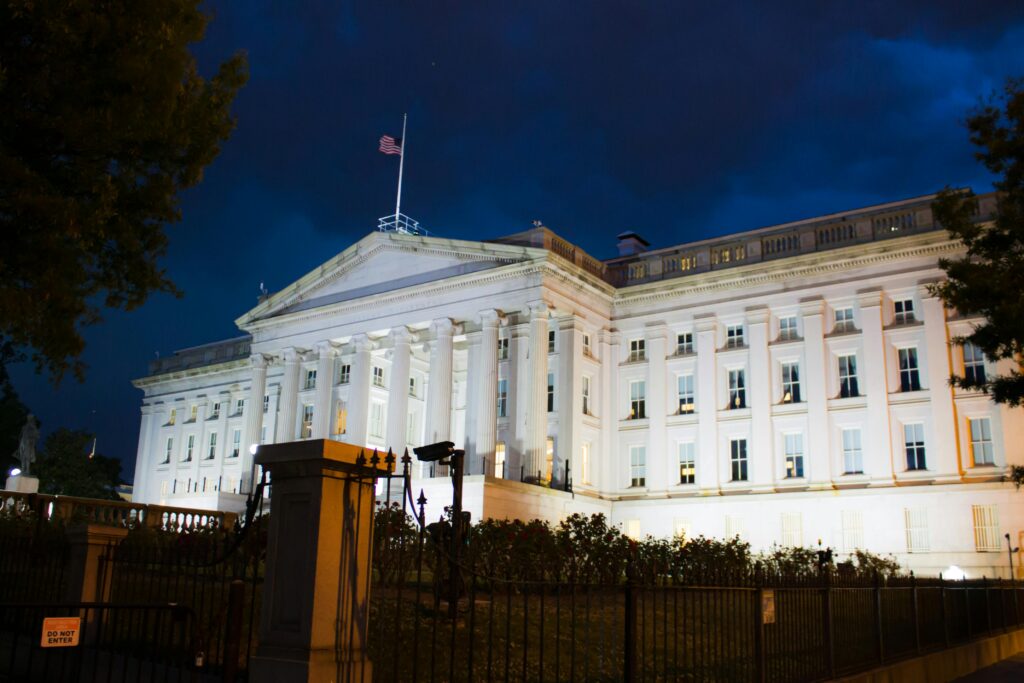 More Than Budgets: How City Decisions Shape Black Communities Stunning view of the U.S. Treasury Building illuminated against a twilight sky in Washington, DC.